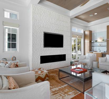 Sink into plush seating while your modern fireplace creates warmth and your open kitchen invites effortless entertaining.