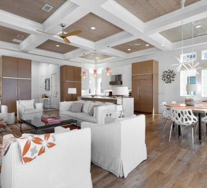 Gather in this stunning open-concept space where your group can cook, dine, and relax together under soaring coffered ceilings.