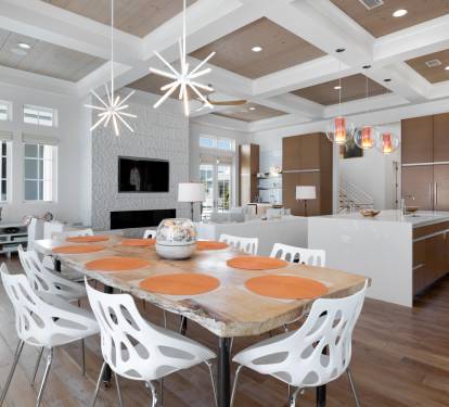 Your spacious open-plan living combines modern dining and kitchen with soaring coffered ceilings and designer lighting.