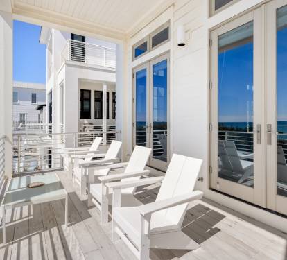 Unwind on your private balcony with gulf views, where white loungers invite you to soak up coastal breezes.