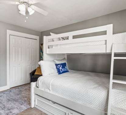 Cozy guest bedroom with bunk beds—perfect for kids, teens, or extra guests after a fun day at the beach.