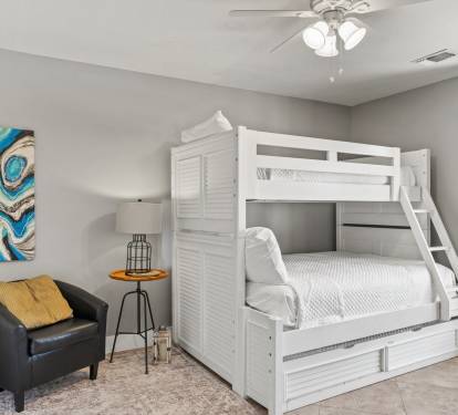 Comfortable bunk room with a twin-over-queen bunk bed and queen trundle—ideal for families and larger groups.