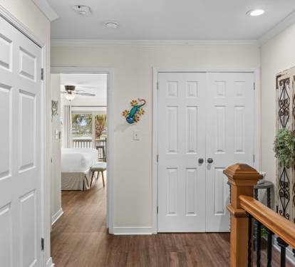 Step into your welcoming hallway with gleaming hardwood floors and bright, airy spaces leading to comfortable bedrooms.