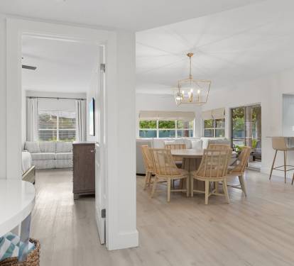 Sunlight pours into this open, coastal-inspired space featuring natural textures and breezy elegance.