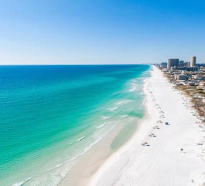 Powder-white sand meets crystal-clear waves—your perfect beach day starts on this stunning shoreline.