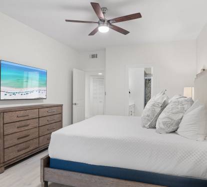 Enjoy restful nights in this calming bedroom retreat with a king bed, queen sleeper sofa, flat-screen TV, and a private en-suite bathroom.