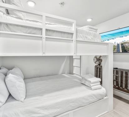 Your cozy bunk bed retreat offers crisp linens and modern comfort, perfect for sharing adventures with family or friends.