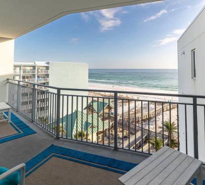 Wake up to breathtaking ocean views from your private balcony, where turquoise waters meet endless sky just steps away.