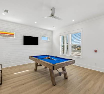 Enjoy a Game of Pool or Catch the Game on the Flat-Screen TV