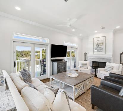 Unwind in the Spacious Living Area - Offering Wall to Wall Lake Views!
