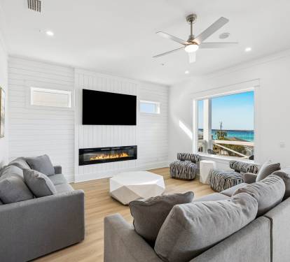 Spacious & Inviting Living Area Offering An Electric Fireplace