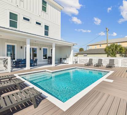 Spend Lazy Days Poolside or Enjoy a Game of Cornhole!