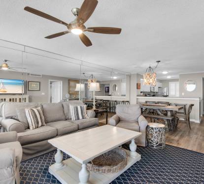 Unwind in this spacious, open-concept living area where coastal elegance meets comfort.