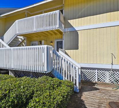 Front of condo. Steps leading to front door