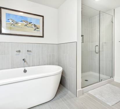 Unwind in your spa-like bathroom with a luxurious soaking tub and spacious glass shower, creating the perfect retreat after your adventures.