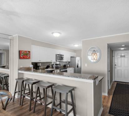 Step into your fully equipped kitchen with breakfast bar seating, granite countertops, and stainless steel appliances—ready for cooking and gathering with loved ones.