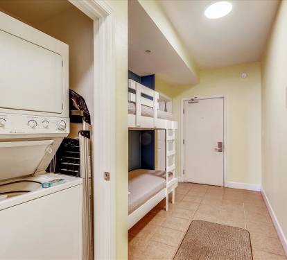 Hall houses bunk area and W/D closet