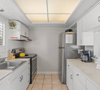 Your fully equipped galley kitchen features modern appliances, ample counter space, and everything you need to prepare meals during your stay.