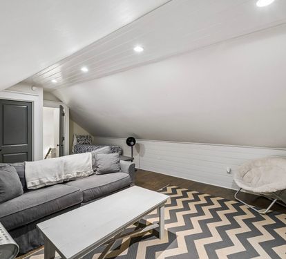 Cozy Seating + Twin Bed for Additional Sleeping Arrangements