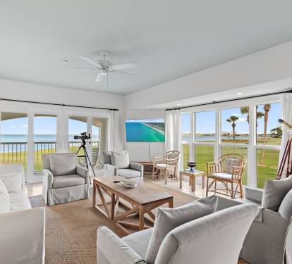 Open-concept living area designed to highlight panoramic golf course and bay views. This second-floor corner condo offers added privacy and is perfectly suited for golf-focused getaways.