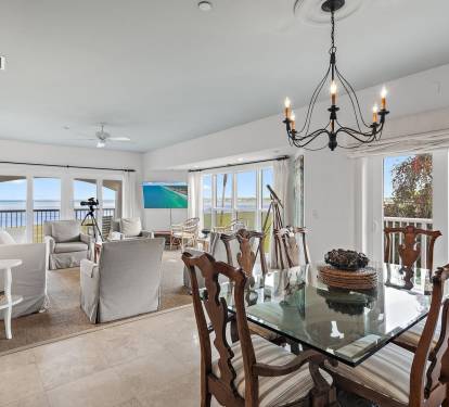 Dining area overlooking the golf course and Choctawhatchee Bay, offering a relaxed setting to unwind after a day golfing in Sandestin.