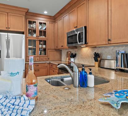 Kitchen with granite countertops and ample prep space, ideal for extended golf stays at Sandestin Golf & Beach Resort.