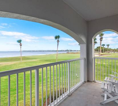 Private second-floor balcony off the living room overlooking the Sandestin golf course and the Choctawhatchee Bay-an ideal spot to unwind before or after a day on the course.