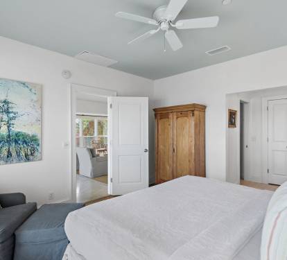 Alternate view of the primary king bedroom, featuring a bright, relaxing layout ideal for extended golf vacations at Sandestin Golf & Beach Resort.