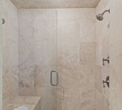Spacious walk-in shower in the primary bathroom-perfect for relaxing after a long day on the golf course at Sandestin.