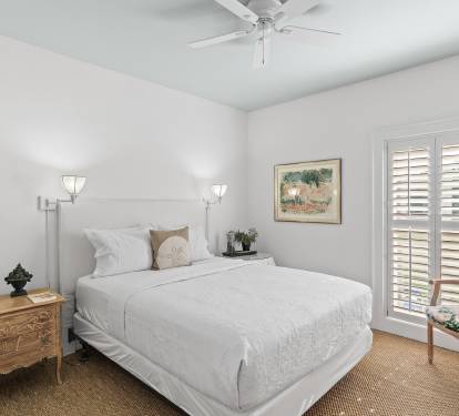 Comfortable guest bedroom inside Sandestin Golf & Beach Resort, offering a quiet and relaxing space for golfers and guests during their stay.