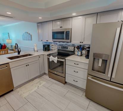 Your fully equipped kitchen features modern stainless steel appliances, granite countertops, and everything you need to create memorable meals during your stay.