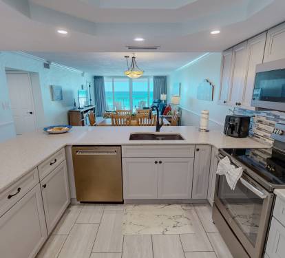 Your fully equipped kitchen features modern appliances and ocean views, perfect for creating memorable meals while staying connected to paradise.