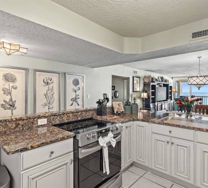 Prepare meals in your well-equipped kitchen while enjoying stunning ocean views through the open living area.