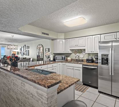 Your fully equipped kitchen features granite countertops, stainless steel appliances, and stunning ocean views for memorable meal prep.