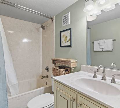 Step into your serene bathroom oasis with elegant marble tub, stylish vanity, and thoughtful coastal touches that make your daily routine feel luxurious.