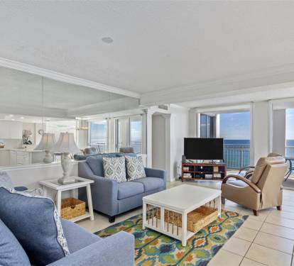 Unwind in your spacious living room where ocean views fill every window and coastal breezes invite relaxation.