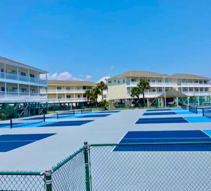 Pickleball courts at Sandpiper Cove Resort offering a fun, active way to enjoy the coastal sunshine, with well-maintained courts and a relaxed resort atmosphere perfect for all skill levels.