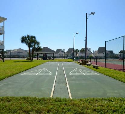 Shuffleboard courts at Sandpiper Cove Resort, providing a fun, laid-back way to enjoy friendly competition and relaxed outdoor time in a sunny coastal setting.