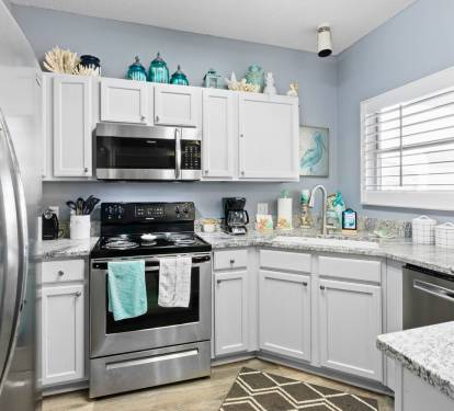 Your fully equipped kitchen features stainless steel appliances and granite countertops, perfect for preparing meals during your stay.