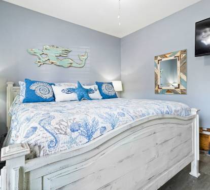 Drift into dreams in your coastal-themed bedroom with ocean-inspired decor and modern amenities.