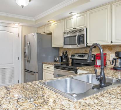 Your fully equipped kitchen features granite counters, stainless appliances, and everything you need to create memorable meals during your stay.