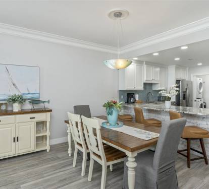 Your bright, open-plan kitchen and dining space features granite counters, coastal décor, and everything needed for memorable meals together.