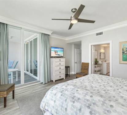 Drift into peaceful sleep in your airy bedroom, where soft sea breezes from your private balcony and gentle ceiling fan create the perfect retreat.