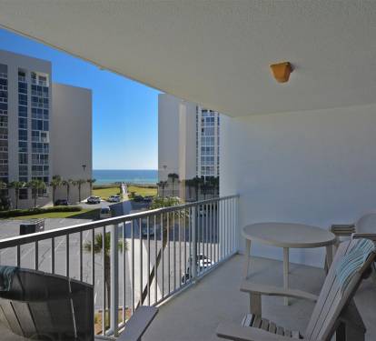 Relax on your private balcony with ocean glimpses between coastal towers, perfect for morning coffee or sunset cocktails.