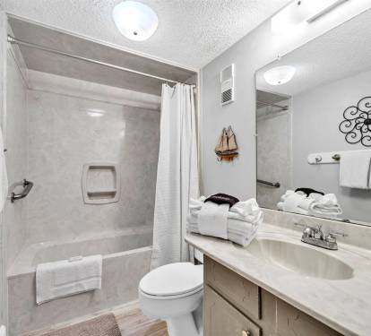 Freshen up in your private bathroom with crisp linens and thoughtful touches for a comfortable stay.