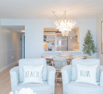 Sink into these dreamy blue chairs where coastal charm meets modern elegance. Your beach getaway begins in this stunning dining space.