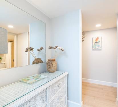 Step into your serene hallway where coastal charm meets modern comfort—natural textures and soft lighting create a welcoming atmosphere.
