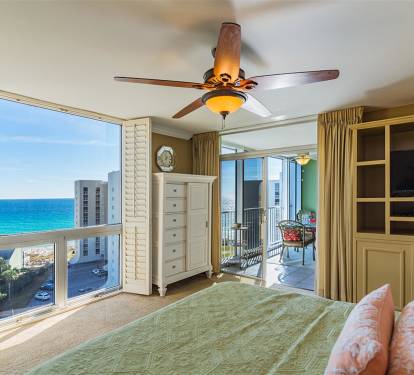 Wake up to stunning ocean views from your coastal bedroom, where turquoise waters stretch endlessly beyond your balcony doors.