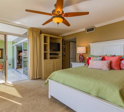 Wake up refreshed in your comfortable bedroom with cheerful tropical colors and sliding doors to your private balcony.