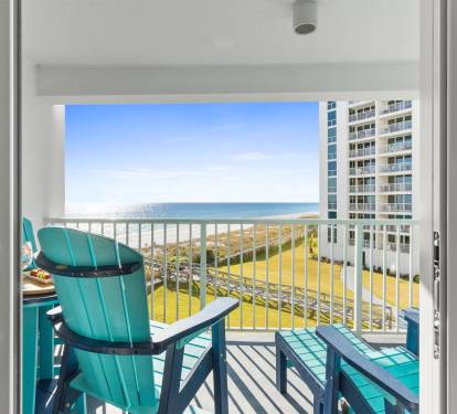 Step out to your private balcony where turquoise chairs invite you to relax with ocean breezes and stunning sea views.
